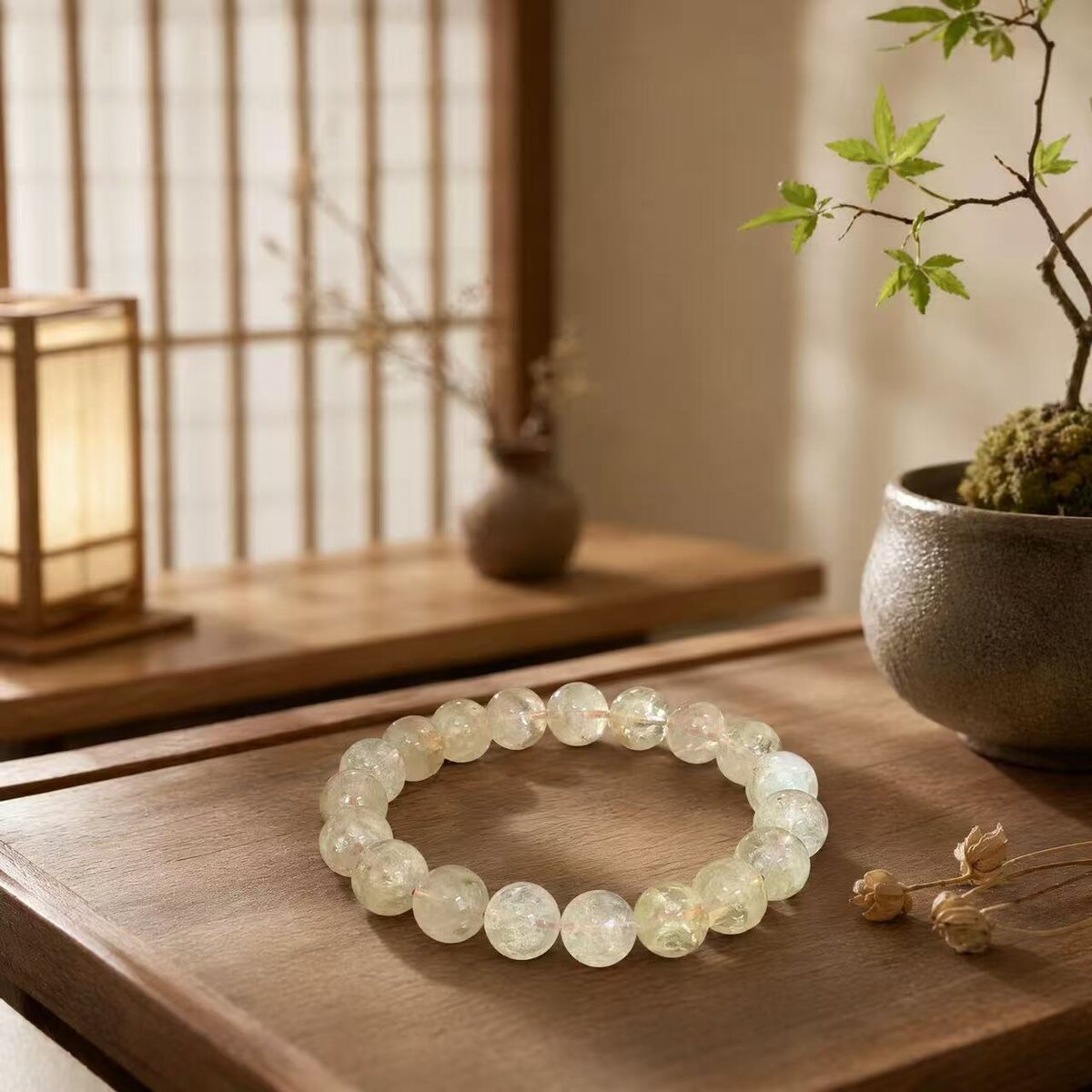 Pale yellow translucent beaded bracelet on a table