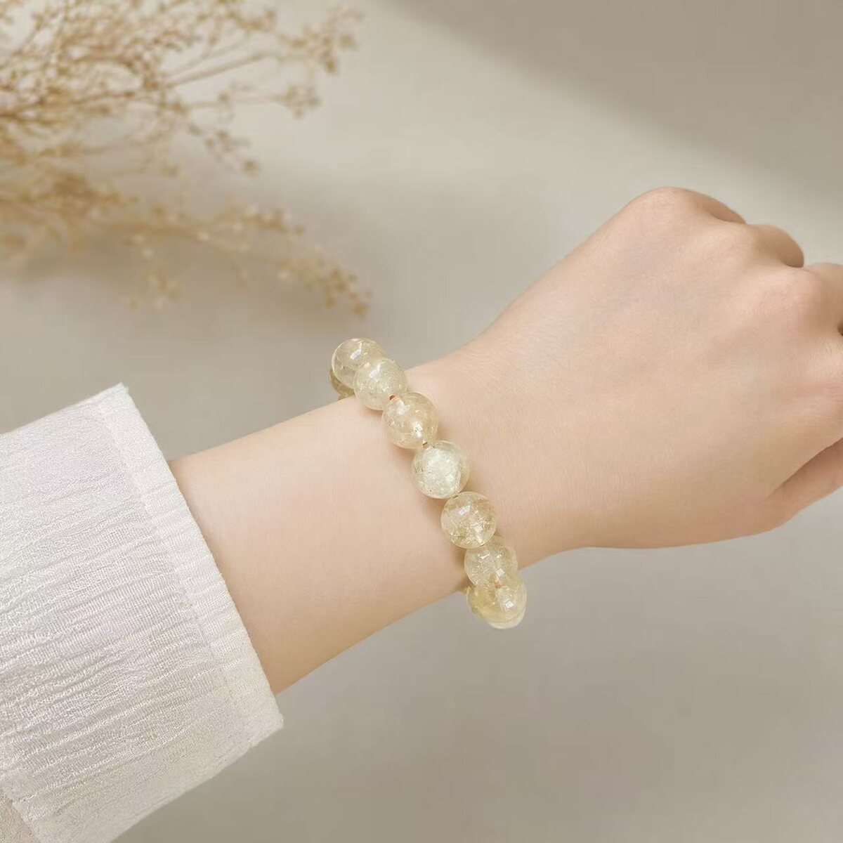 BR-025 pale yellow bracelet worn on wrist
