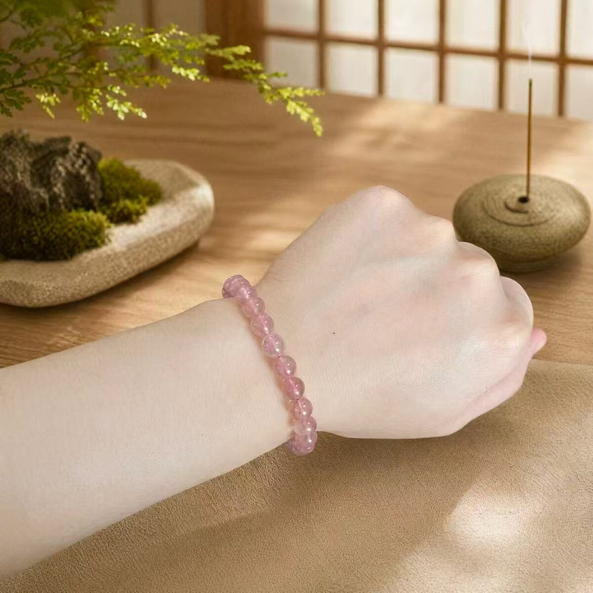 BR-026 transparent pink bracelet worn on wrist