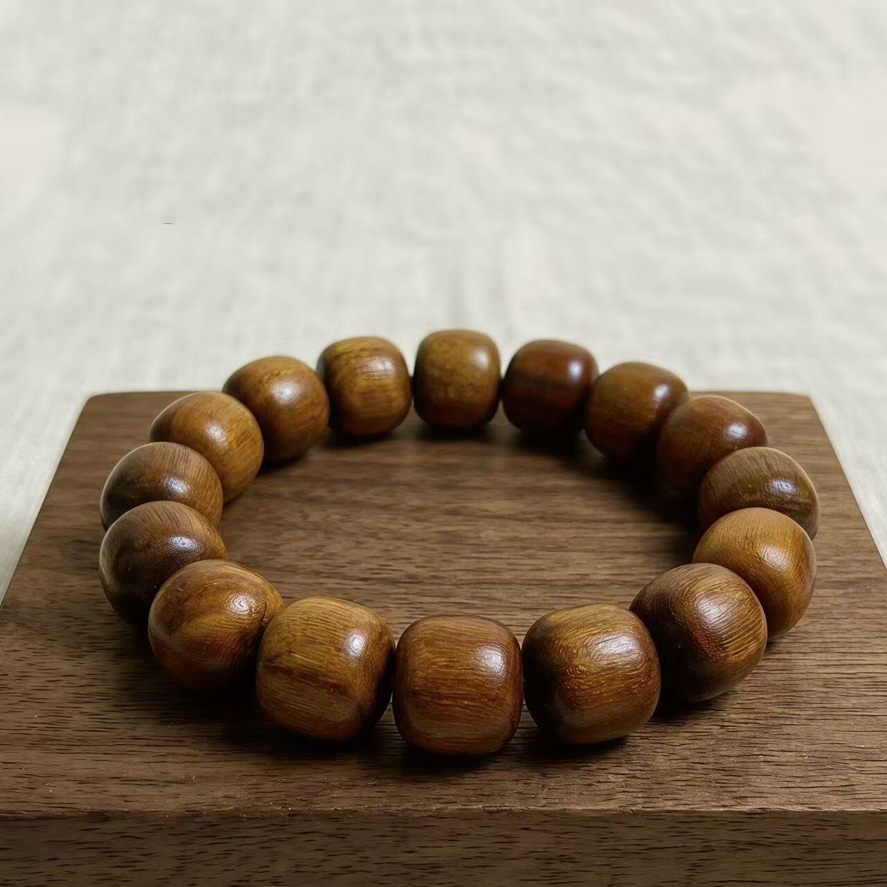 Vietnamese huanghuali wood beaded bracelet on a tea tray